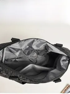 Internal capacity display of large travel bag with grey lining and mesh pockets