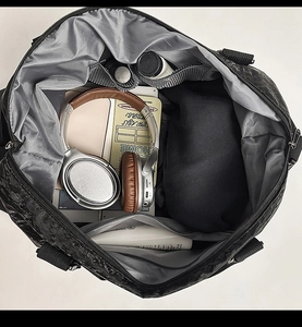 Interior view of large travel bag with multiple compartments for organized storage