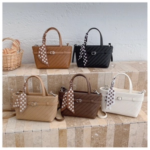 Close-up of woven texture tote bags with decorative scarves in five various colors