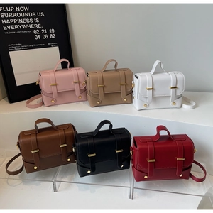 Collection of minimalist square crossbody bags in six vintage colors on display