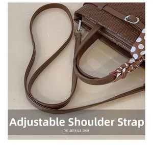 Detail of brown woven bag showing adjustable strap and elegant polka dot silk scarf handle