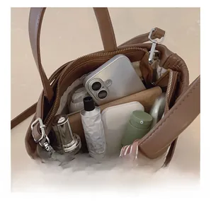 Internal view of brown woven tote bag showing large capacity for daily items