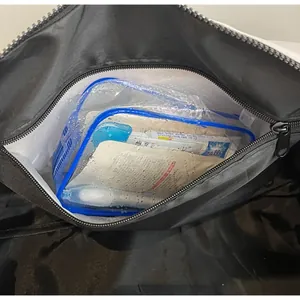 Detail of the internal waterproof compartment for wet-dry separation in travel bag