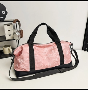Detail of pink marble pattern travel bag with wet-dry separation and adjustable strap