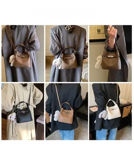 Mini bucket bags in multiple colors showing lychee grain leather and metal lock details