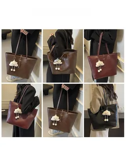 Detailed views of multi-color tote bags with plush cloud charms on models