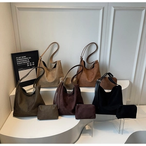 Set of suede shoulder tote bags in olive green, brown, and black with small pouches