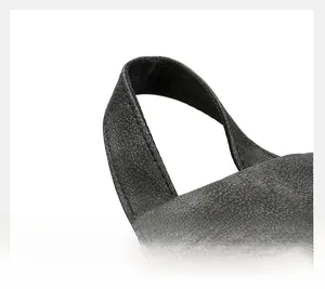 Close-up of dark grey high-capacity backpack handle with reinforced double stitching
