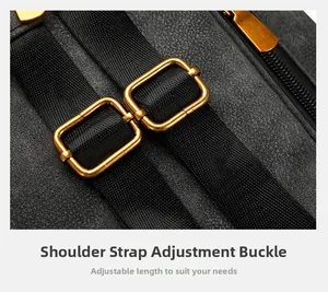 Close-up of adjustable strap buckle with gold metal hardware and pebbled leather
