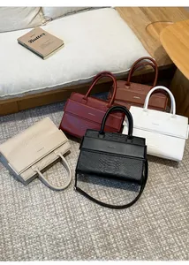 Variety of crocodile pattern tote bags in diverse colors with detachable shoulder straps