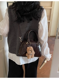 Retro dark brown polished leather bowling bag with teddy charm and silver hardware