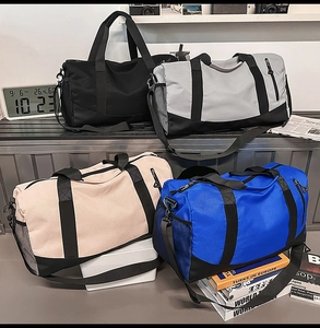 Multi-colored travel duffel bags with separate shoe compartment and adjustable shoulder straps
