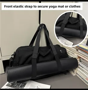 Close-up of front elastic strap for securing yoga mats or clothing on a black gym bag