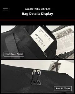 Detail view of black nylon travel bag featuring dual smooth zippers and front pocket