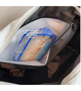 Detail of waterproof dry and wet separation pocket inside the travel duffle bag