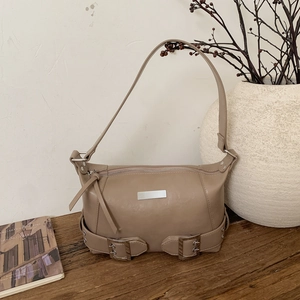 Fashionable beige faux leather shoulder bag with metallic buckle and minimal chic design