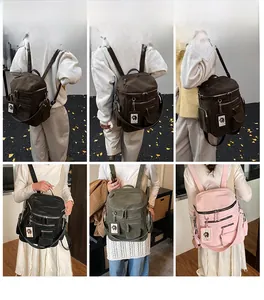 Detail view of large capacity multi-pocket backpacks in four trendy winter colors