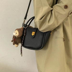 Black lychee leather bucket tote bag with gold lock and cute teddy bear charm