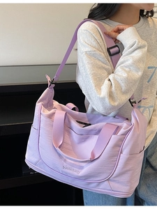 Light purple large capacity travel duffel bag with separate shoe compartment and shoulder strap