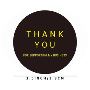 Black round Thank You stickers with gold foil text and 1.5 inch size measurement mark