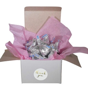 White corrugated gift box with pink tissue paper and gold foil Thank You sticker