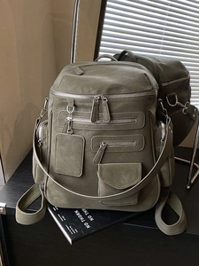 Army green multi-pocket large capacity backpack with textured finish and silver zippers