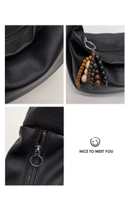 Detailed macro shots of black lychee leather bag texture with colorful wooden beads