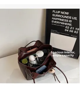 Detail of spacious dark brown tote bag interior with large storage capacity