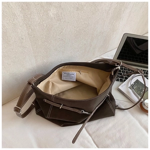 Interior view of brown canvas tote bag showing large capacity with zipper pocket