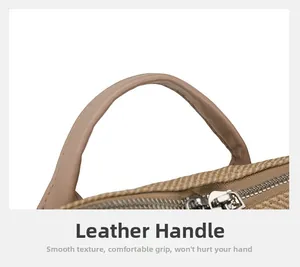 Detail of khaki leather handle and textured body with silver metal zipper on backpack