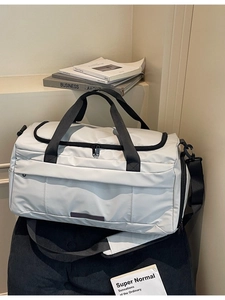 Off-white large gym bag with dry wet separation compartment and adjustable strap