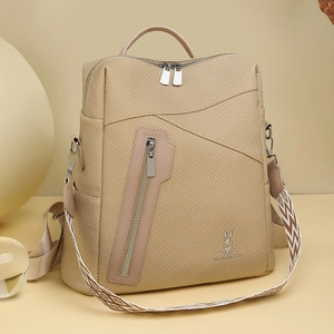 Close-up of khaki versatile backpack featuring stylish geometric strap and rabbit emblem