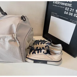 Travel bag featuring a separate side zipper compartment for shoes to keep gear organized