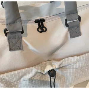 Detail of Wellabeg travel bag featuring waterproof fabric and reinforced zipper closure