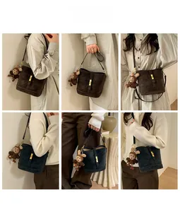 Detailed views of vintage matte leather bucket bags in brown and navy blue with bear charm