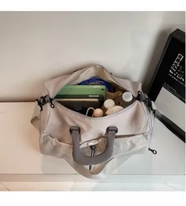 Top view of large capacity travel bag showing organized interior with tablet and notebooks