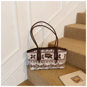 Detail of vintage plush tote bag with woven texture and premium leather trim details