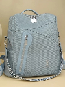 Minimalist light blue women backpack with woven texture and rabbit icon for daily use