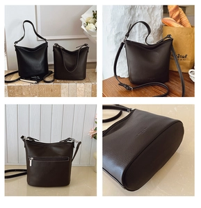 Detailansicht der Leder-Eimertasche mit Narbung, Metallreißverschluss und Trageriemen