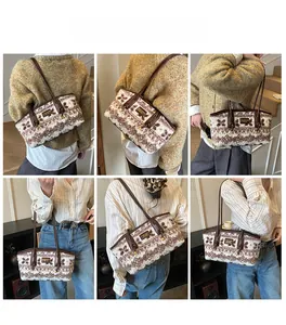 Detail of vintage bohemian pattern plush tote bag with brown leather shoulder straps