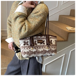 Detail of plush winter tote bag featuring vintage geometric patterns and leather handles