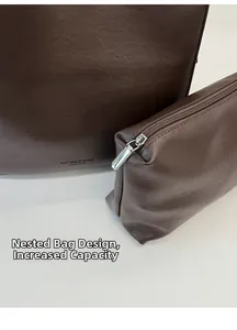 Detail of dark brown leather tote bag set with matching inner pouch for extra storage