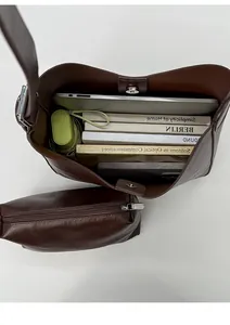 Interior view of brown faux leather tote bag with magnetic clasp and inner zipper pouch
