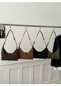 Detailed row of retro matte leather shoulder bags in multiple colors with adjustable straps