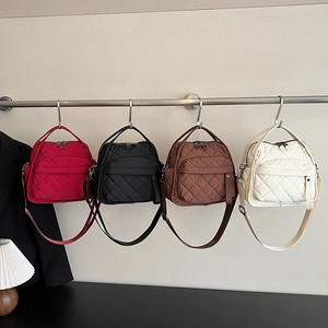 Quilted nylon crossbody bags in deep red, black, brown, and cream white colors