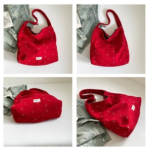 Detailed views of a large red tote bag with silver star prints and fabric texture
