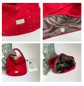 Close-up of red wool tote bag detail showing magnetic clasp and star pattern fabric