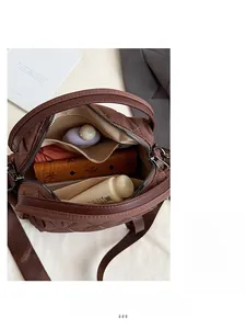 Interior view of brown quilted tote bag showing spacious compartments and zipper pockets