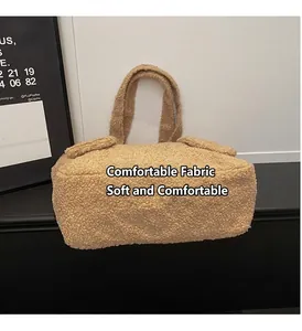 Close-up of soft teddy plush fabric and texture on a light brown tote shoulder bag
