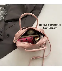 Interior view of the pale pink leather Boston bag showing spacious storage for daily items